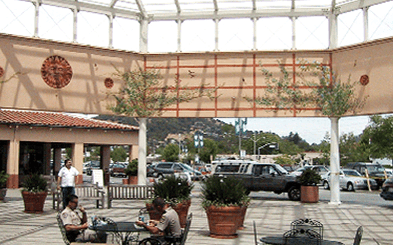 People sitting in a plaza setting