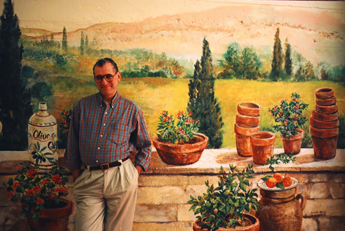 Individual posing with Italian countryside backdrop