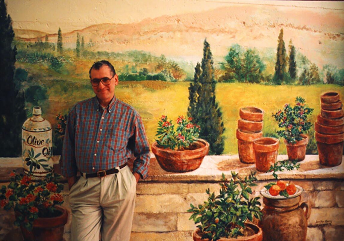 Individual posing with Italian countryside backdrop
